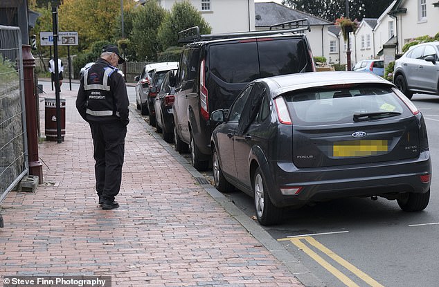 The Kent town's council bosses are not alone in tightening up local parking. Elsewhere in the south-east county, the Medway local authority issued 32 per cent more PCNs in 2023-24 compared with 2021-22. Pictured: A traffic enforcement officer patrolling in Tunbridge Wells