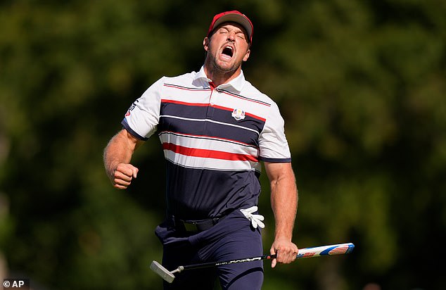 United States' Bryson DeChambeau celebrates after a putt on the 12th hole during their singles match on the Bethpage Black golf course at the Ryder Cup golf tournament, Sunday, Sept. 28, 2025, in Farmingdale, N.Y. (AP Photo/Robert Bukaty)