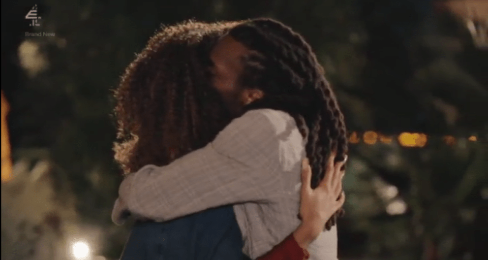Two people hugging.