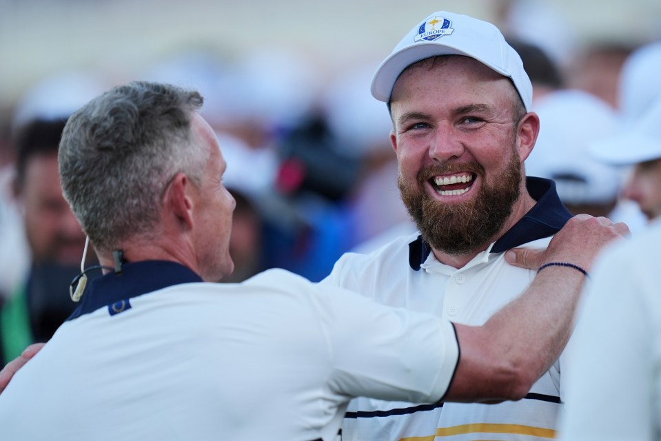 Shane Lowry celebrates with captain Luke Donald at the Ryder Cup.