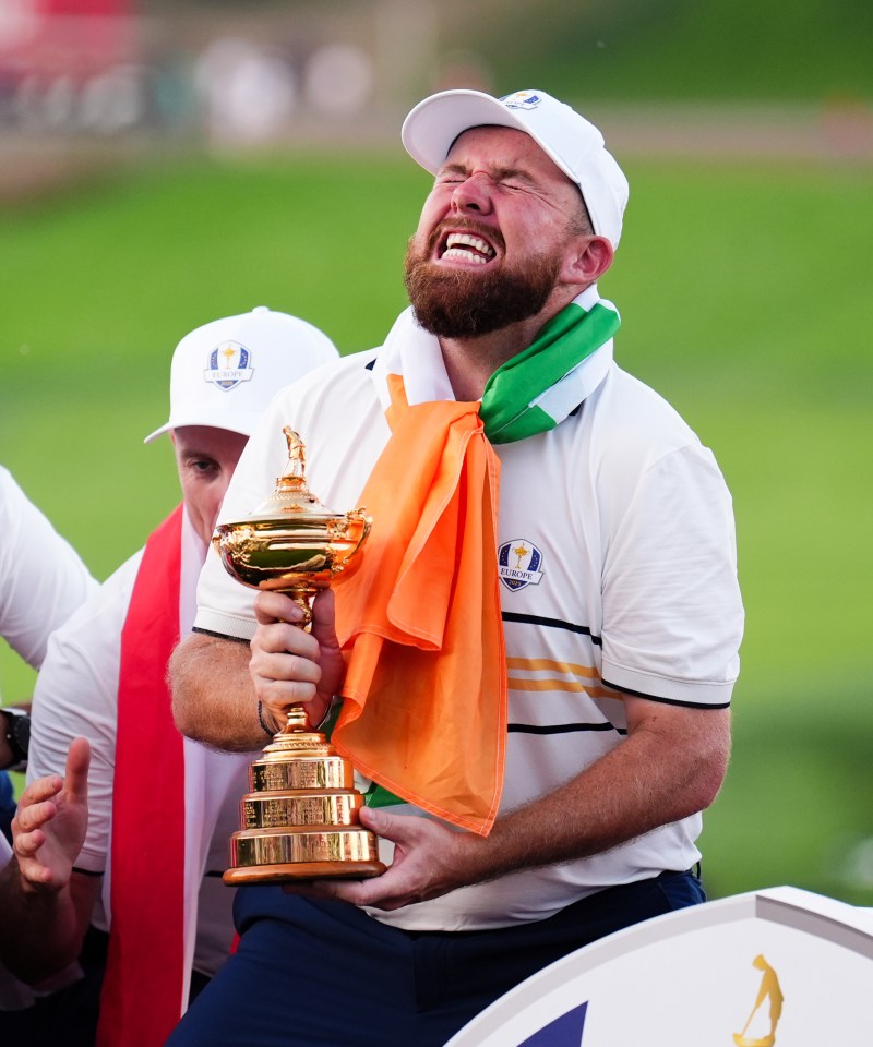 Shane Lowry celebrating with the Ryder Cup Trophy.