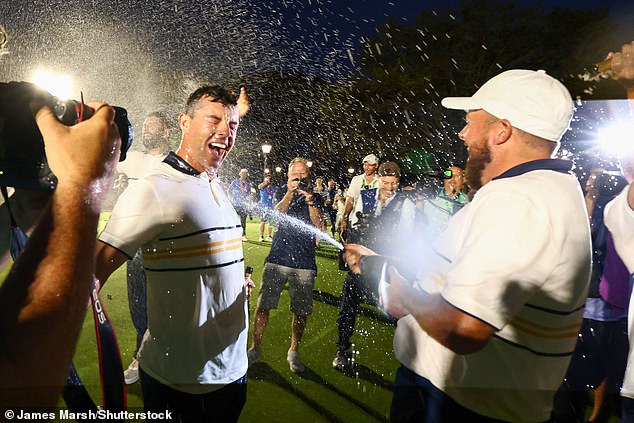 He covered his good friend and teammate McIlroy in champagne on the grass at Bethpage