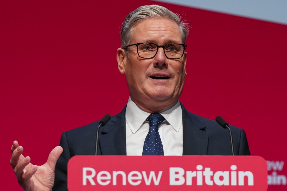 Keir Starmer speaking at the Labour Party conference with a red podium reading "Renew Britain."