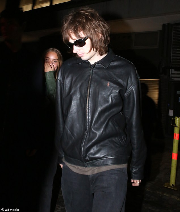 Liam's son Gene, 24, made an appearance, shielding his eyes with a pair of sunglasses