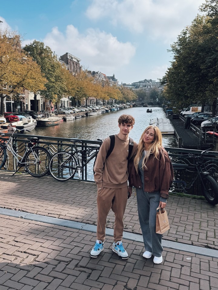 Stacey Solomon and her son Zach posing on a bridge over a canal in Amsterdam.