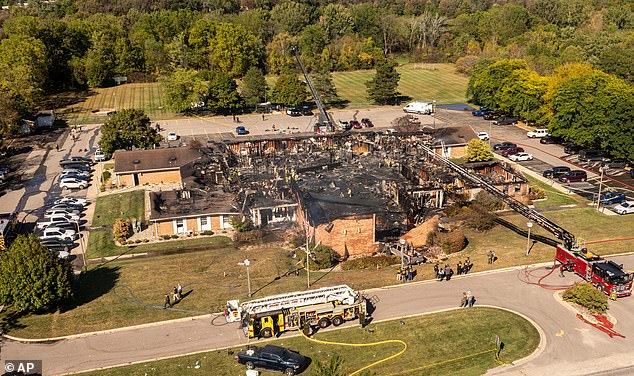 The charred wreckage of the building is still being searched