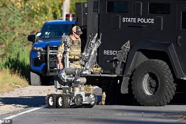 Police and state troopers were seen at the shooter's home as they conducted the invetsigation