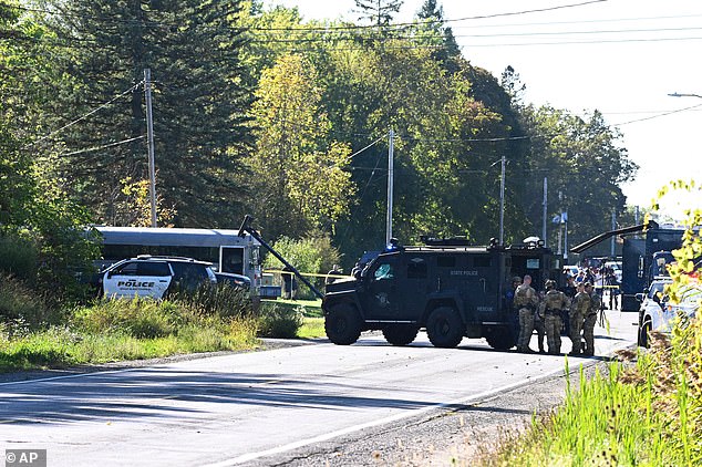 Police and law enforcement teams were pictured at Sanford's home on Sunday after the shooting