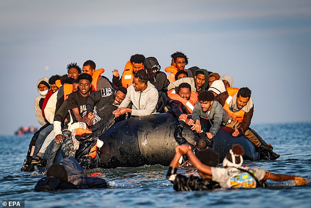 Mr Farage said the claim was an ¿insult¿ to millions who want the Government to finally get a grip on immigration. Pictured: Migrants preparing to attempt a Channel crossing from France yesterday