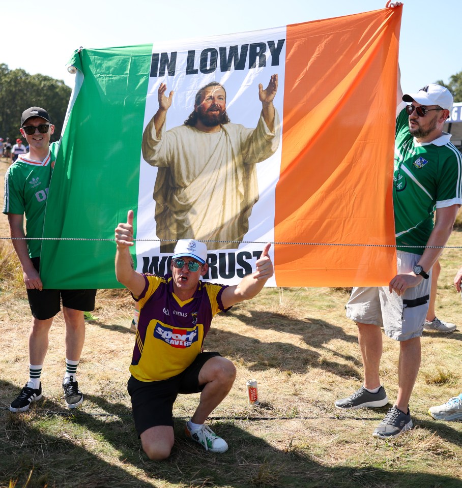 Fans of Team Europe hold a sign that reads, "In Lowry We Trust".