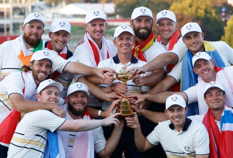 Team Europe captain Luke Donald and his team celebrate with the Ryder Cup trophy.