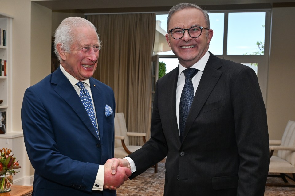 King Charles III and Prime Minister Anthony Albanese shake hands at Parliament House.