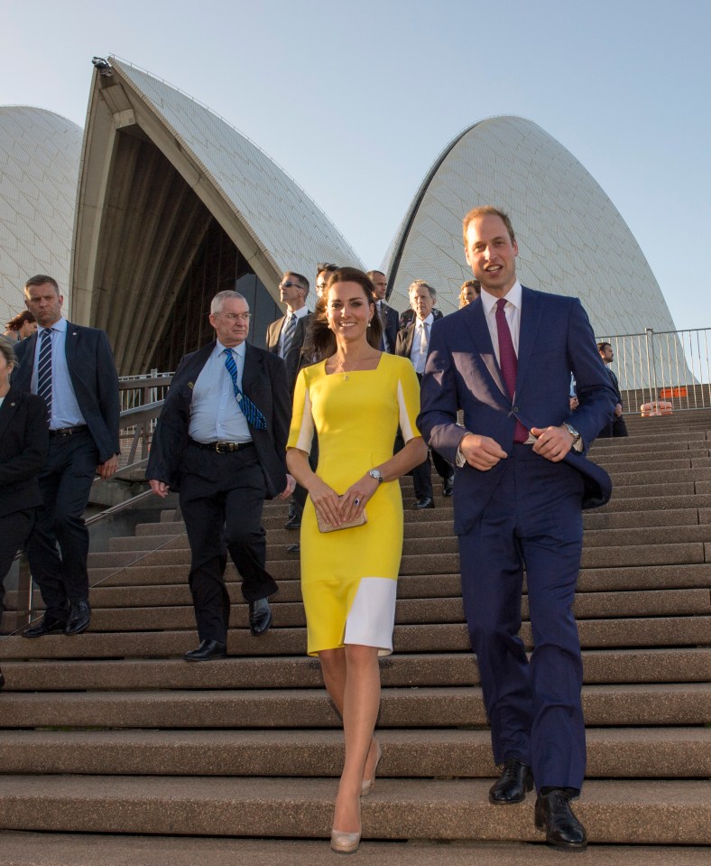 The Duke and Duchess of Cambridge walk down stairs at the Sydney Opera House.