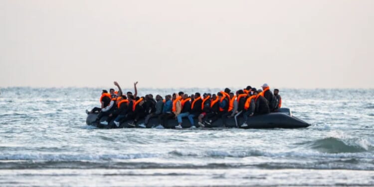 Record 125 migrants arrive on SINGLE 'mega-dinghy'... hours before PM branded Farage’s migration plan ‘racist’