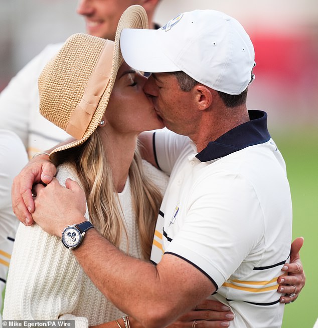 At the end of an emotional week, McIlroy kisses his wife Erica at the Ryder Cup where Europe beat the US 15-13