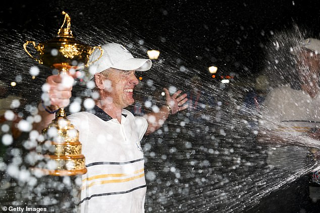 European captain Luke Donald is sprayed with champagne after leading his team to an 11th Ryder Cup in their last 15