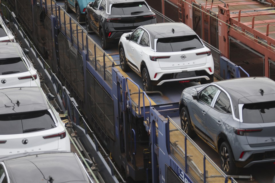 New Opel Mokka cars being transported on a freight train.