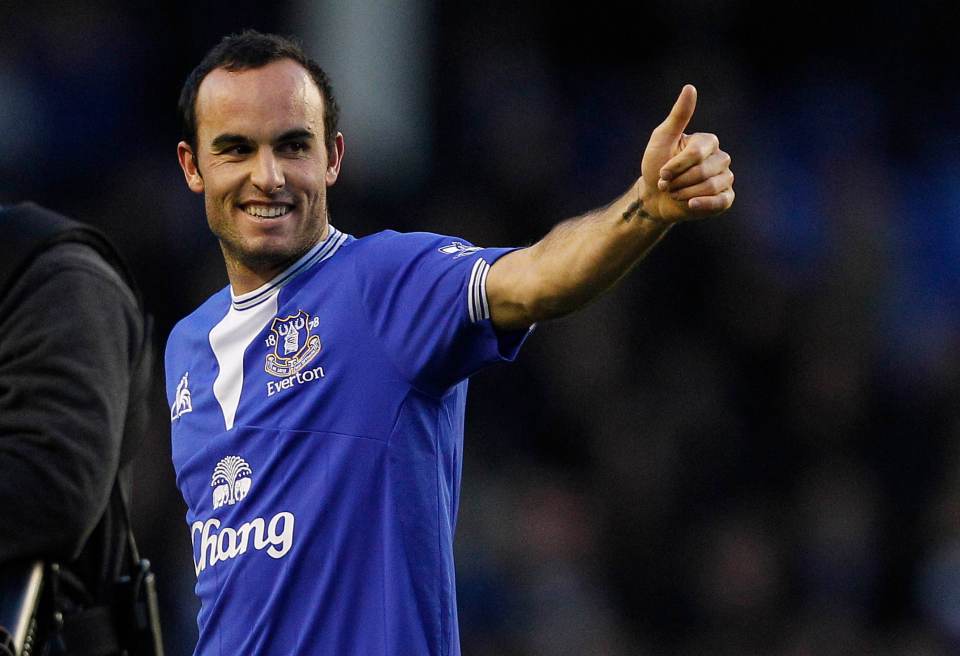 Landon Donovan giving a thumbs up to the crowd while wearing an Everton jersey.