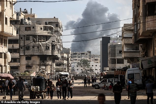 Smoke rises over destroyed residential buildings following the Israeli attacks in Gaza City -- September 29, 2025