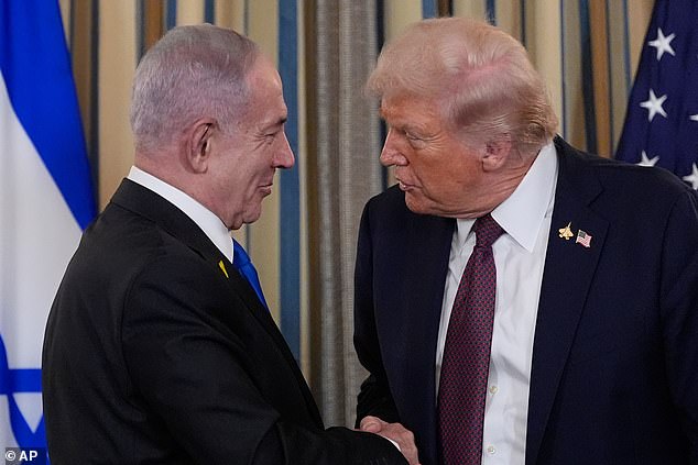 Netanyahu shakes hands with Trump after a news conference in the State Dining Room of the White House -- September 29, 2025