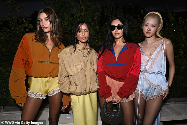 As some of fashion's biggest stars kicked off Paris Fashion Week, Hailey posed for snaps with Zoe Kravitz, Charli and the south Korean singer Rose