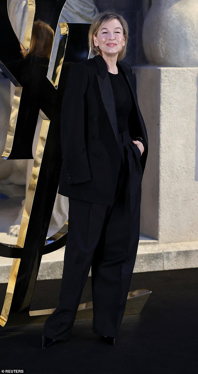 Renee Zellweger cut a chic figure in an elegant black trouser suit as she posed for snaps ahead of the show