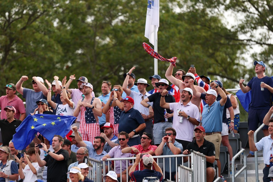 Spectators cheering from the 13th hole grandstand during the Ryder Cup.