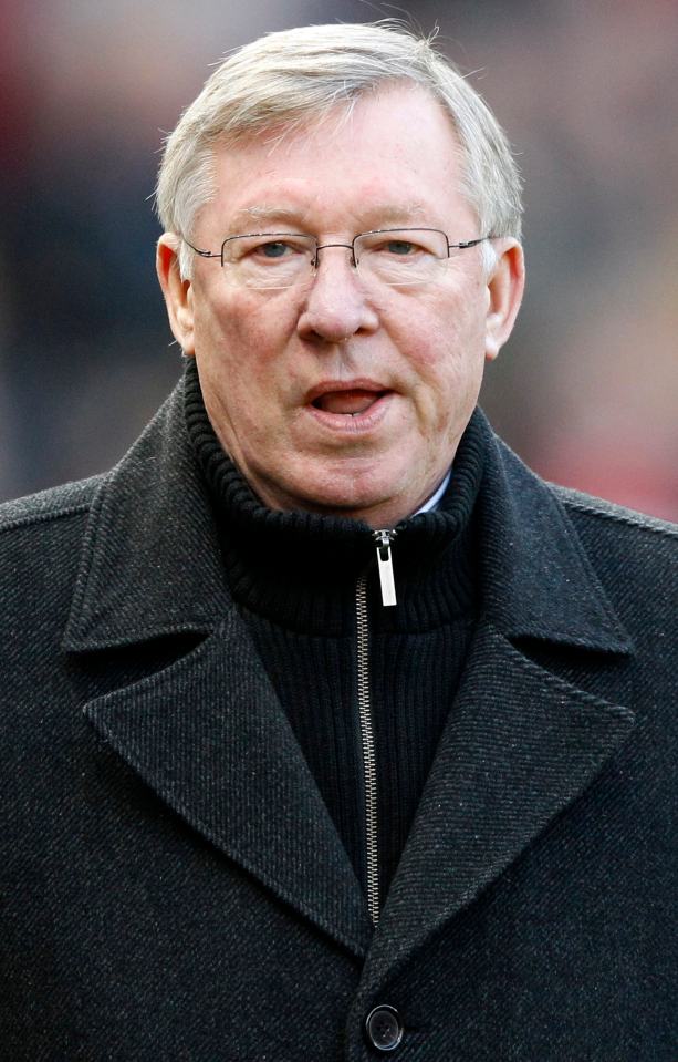 Manchester United's manager Alex Ferguson walking to his seat.