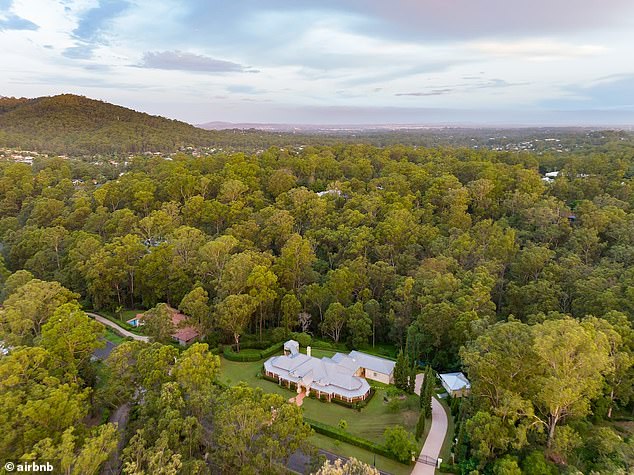 The sprawling property backs onto Mt Coot-tha National Park