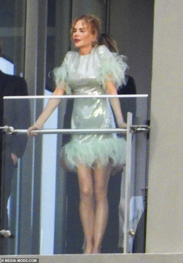 The Big Little Lies actress paid an eye-watering $7.7 million for the chic three-bedder, which offers a commanding view of Sydney Harbour. Pictured: Nicole enjoys the view from the luxury high rise apartment block