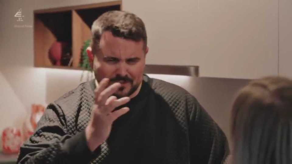 Dean, from Married at First Sight, looking distressed and holding his hand to his mouth.