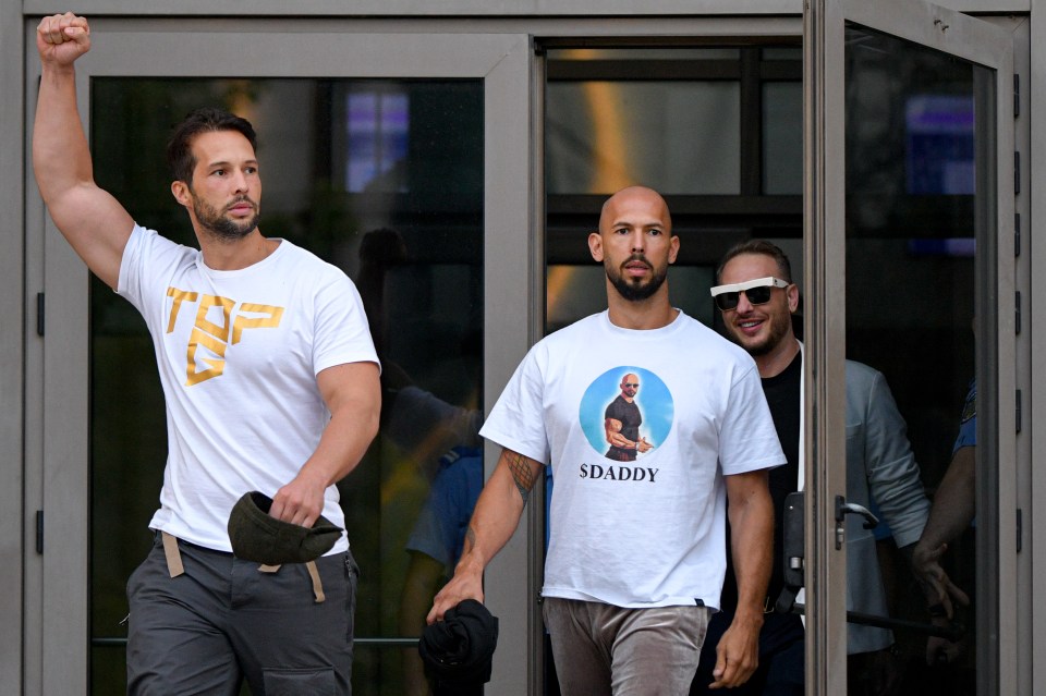 Andrew Tate, center, and his brother Tristan, left, exit the Bucharest Tribunal after being placed under house arrest.