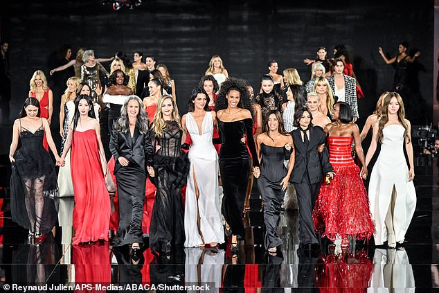 The ladies held hands as they took to the runway together