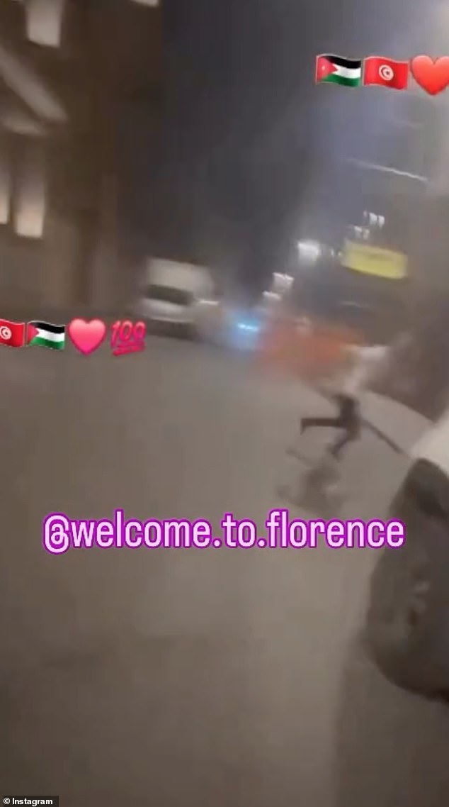 The Jewish tourists running away down the street, appearing to try and escape an attack