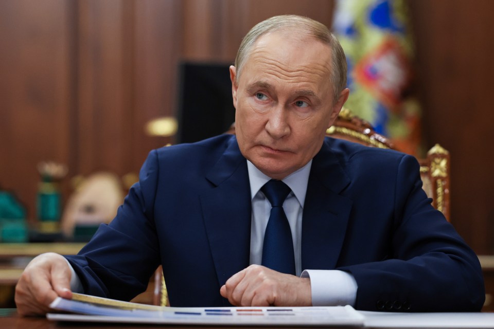 Russian President Vladimir Putin listens to Moscow-appointed head of Russian-controlled Luhansk region Leonid Pasechnik during their meeting at the Kremlin in Moscow, Russia, Tuesday, Sept. 23, 2025. (Alexander Kazakov, Sputnik, Kremlin Pool Photo via AP)