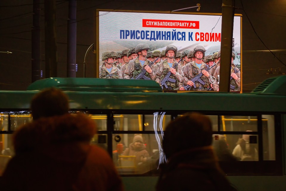 A Ministry of Defense billboard in St. Petersburg calls citizens to join Russia's military operation in Ukraine.
