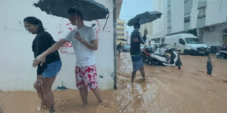 Ibiza swamped by floods in ‘red alert’ storm with streets turned to rivers & airport deluged as Spain