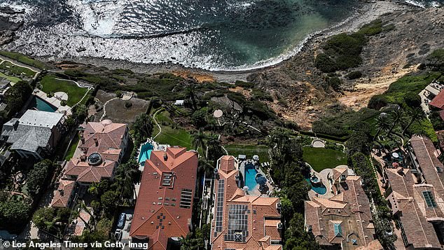 The bluffs fell 50 to 60 feet down towards the ocean, nobody was asked to evacuate their homes and no homes are threatened, officials said