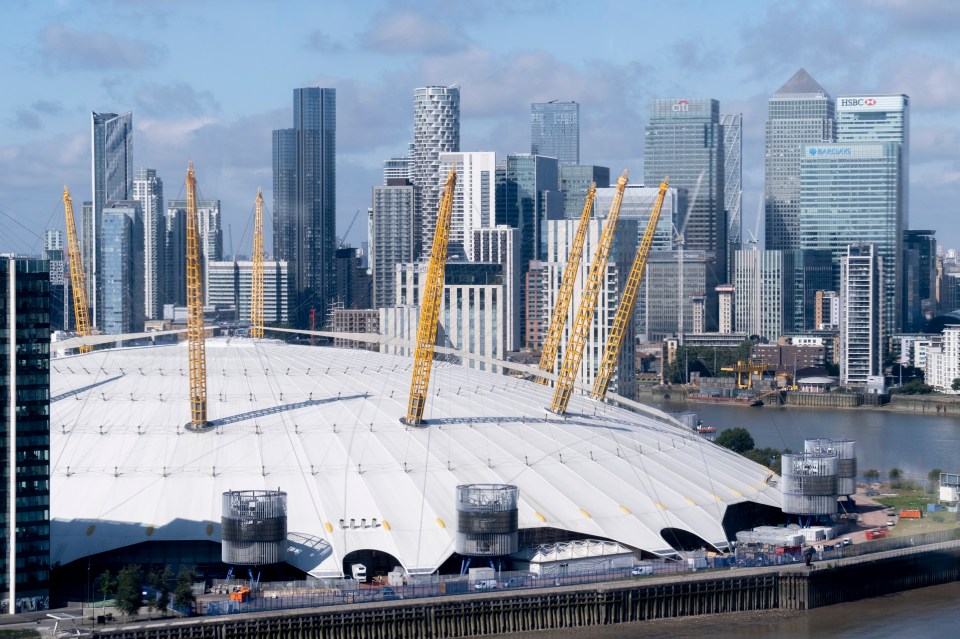 Aerial view of the O2 Arena and distant London Docklands from an Emirates Air Line cable car.