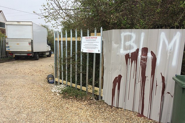 Pennant was also accused of spray painting BLM graffiti (pictured) onto metal sheeting which faced his neighbours' property