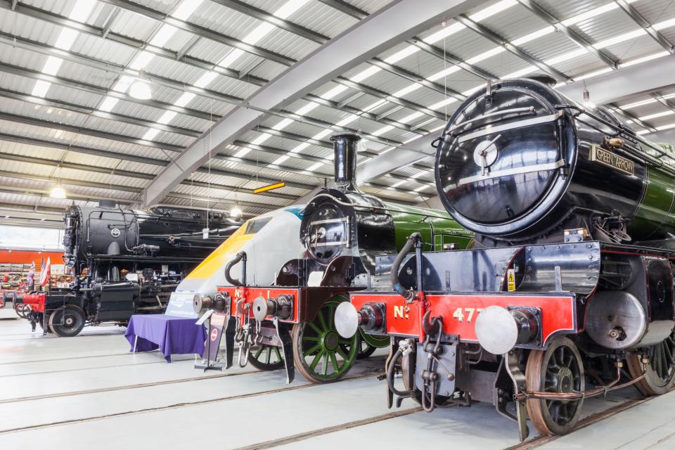 A display of historical train engines at the Locomotion National Railway Museum in Shildon, County Durham, England.