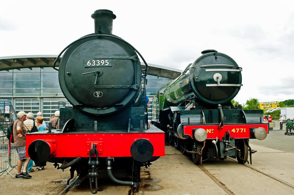 Two steam locomotives, No. 63395 and No. 4771 Green Arrow, at the Locomotion Museum.