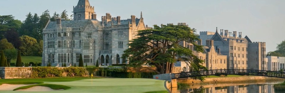 Adare Manor with a golf course and river in front.