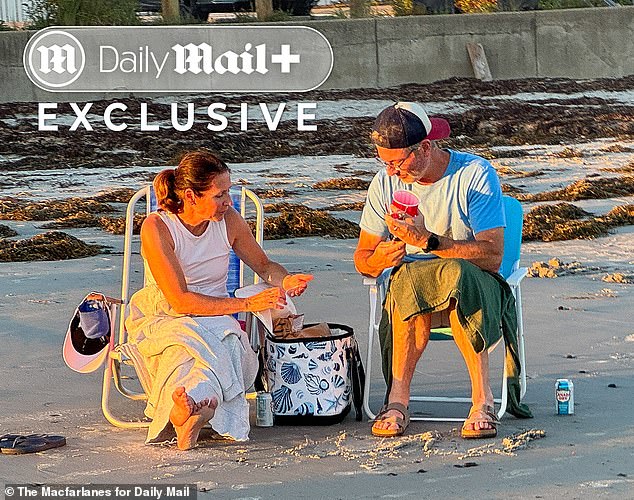 But exclusive Daily Mail photos show the couple's marriage is still standing strong, with the pair enjoying a cozy sunset picnic at the beach near their property in Kennebunk, Maine on Friday