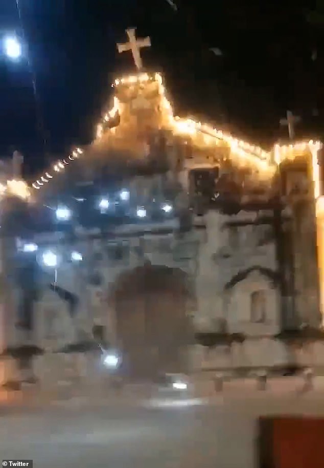 Parts of St. Peter and Paul Church, including a large cross and lighting decorations, crumbled to the floor as the ground rattled