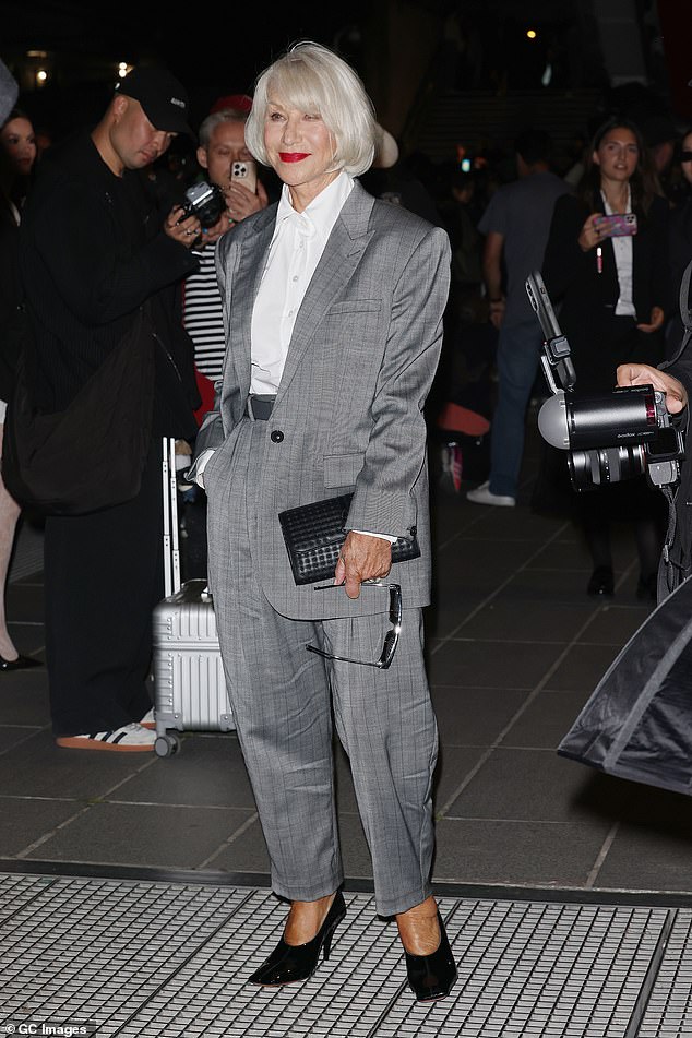 Helen Mirren also showed off her effortless sense of style in a chic grey trouser suit as she made her way into Stella's show