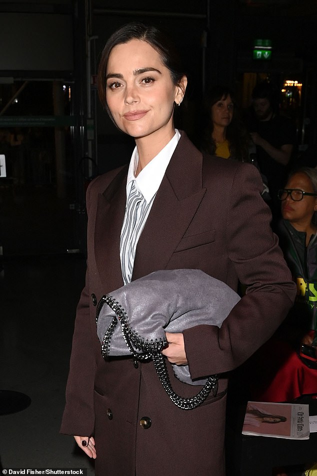 The actress accessorised her outfit with an oversized grey leather clutch bag