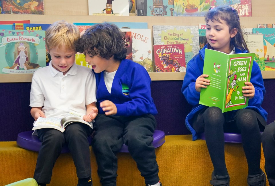 Children from Willow School reading in the library.