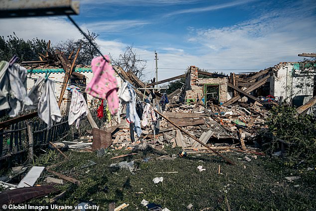 At least 65 drones targeted Ukraine overnight, the latest in daily barrages launched by Moscow. Pictured: Remains of the building targeted by Russian strikes on Chernechchyna, Sumy Oblast, Ukraine on Tuesday