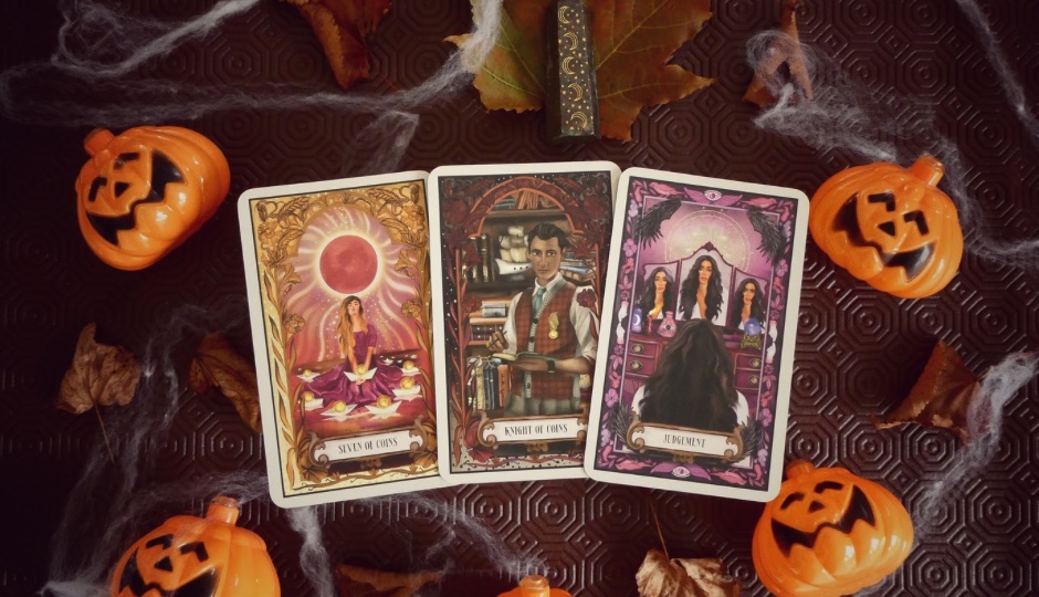 Three tarot cards, "Seven of Coins," "Knight of Coins," and "Judgement," on a Halloween-themed background with decorative pumpkins and spiderwebs.